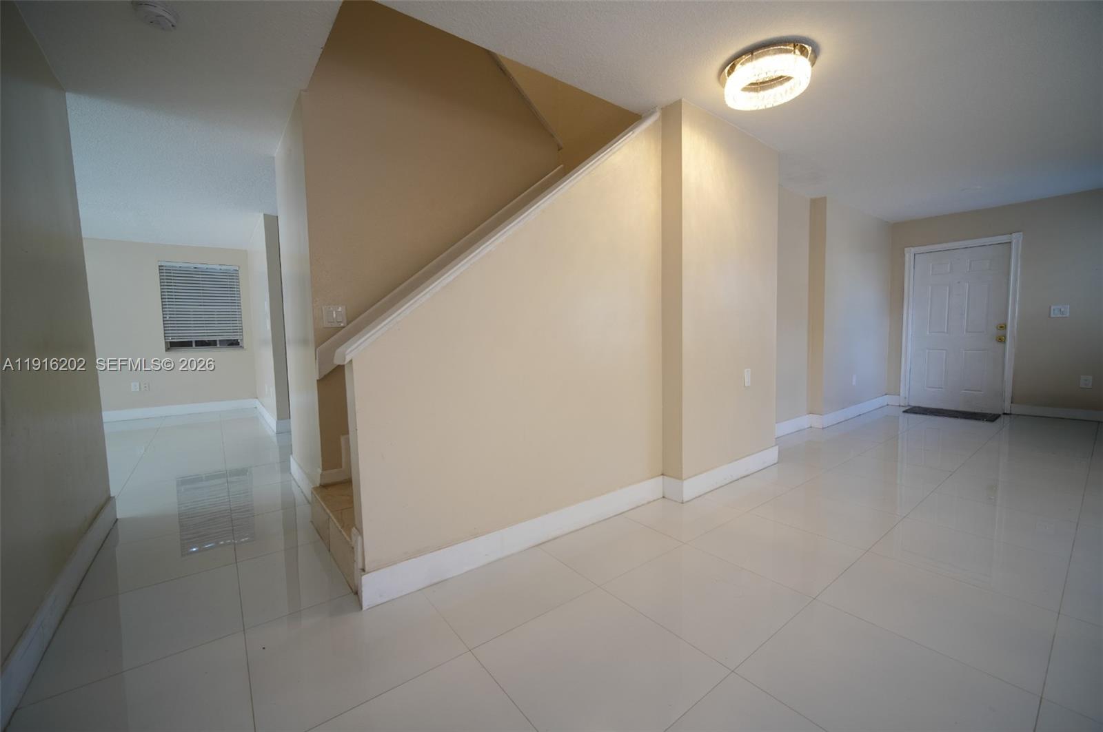 8568 Southwest 211th Terrace, Unit 8576 Cutler Bay, FL 33189 - Photo 18 of 26 a view of an empty room