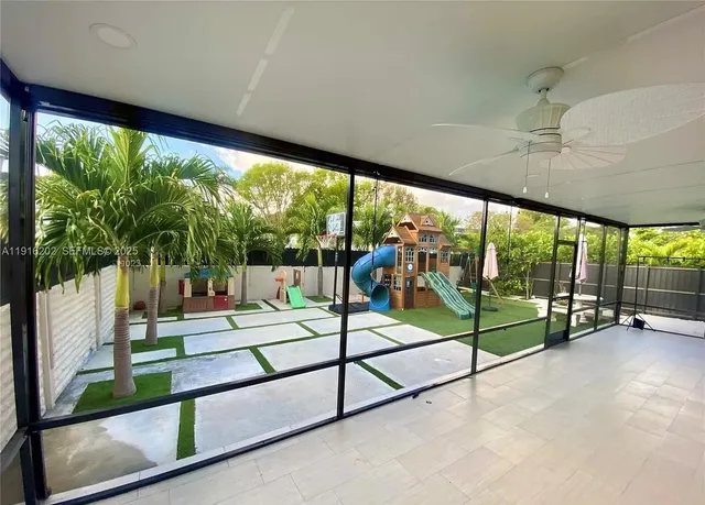 a view of a room with porch and wooden floor