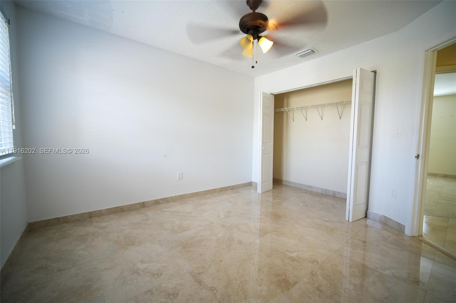 8568 Southwest 211th Terrace, Unit 8576 Cutler Bay, FL 33189 - Photo 8 of 26 an empty room