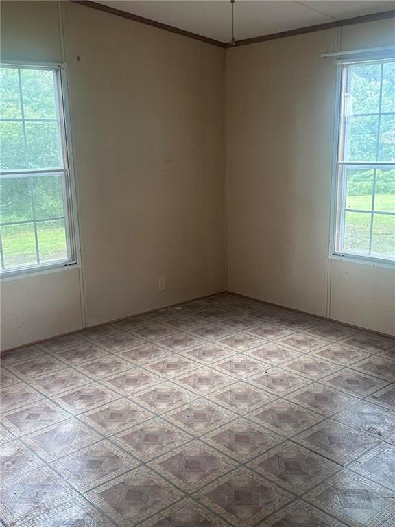 749 Chambers Road Commerce, GA 30530 - Photo 4 of 13 an empty room with a window