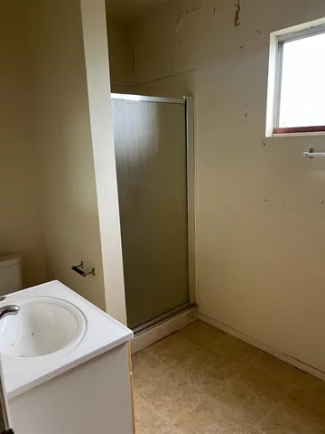 a bathroom with a sink and vanity