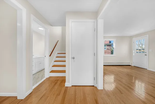 a view of wooden floor and stairs in a room