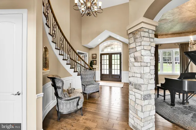 a bathroom with a granite countertop sink mirror and shower