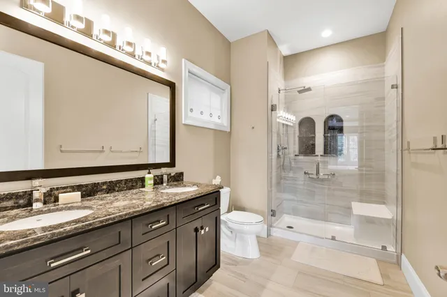 a bathroom with a shower and a sink