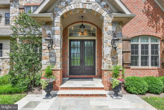 a view of entryway livingroom and hall with wooden floor