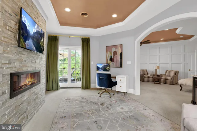 a kitchen with a sink and large windows