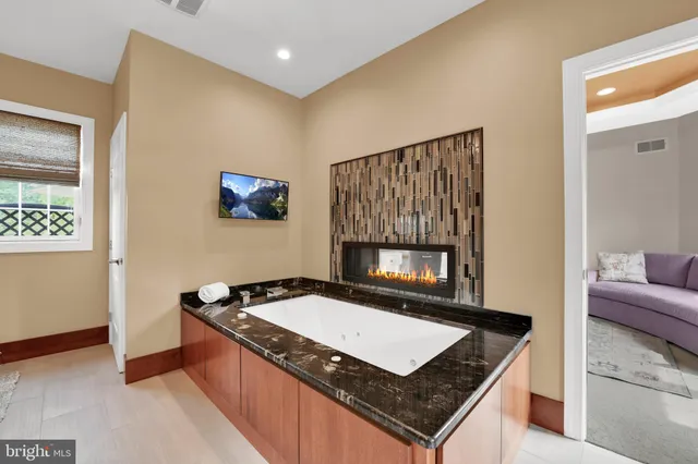 a view of swimming pool with outdoor seating and city view