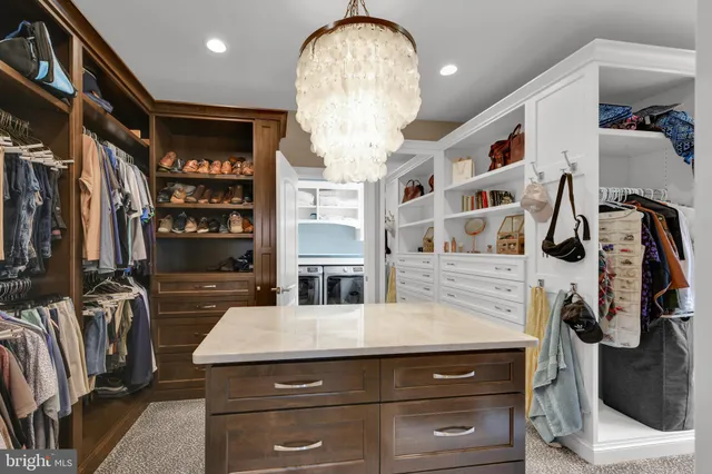 a view of a chair and table in backyard of the house