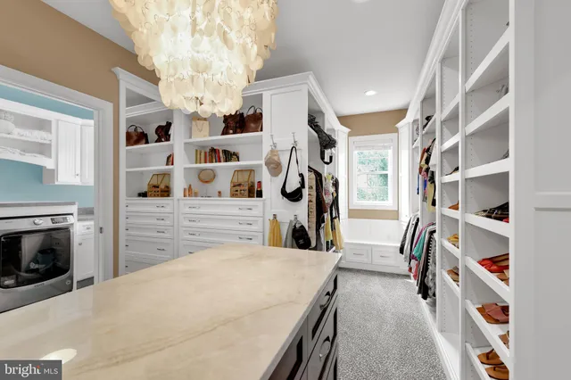 a front view of a house with a garden and yard