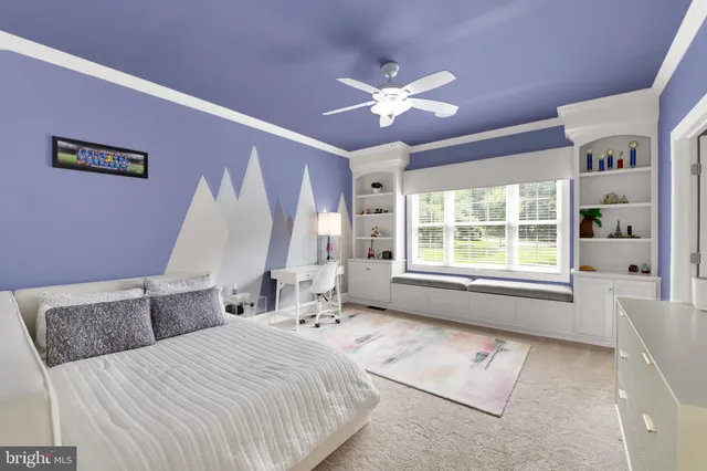 a front view of a house with a garden and plants