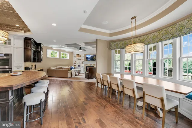 a kitchen with stainless steel appliances granite countertop a sink and a stove