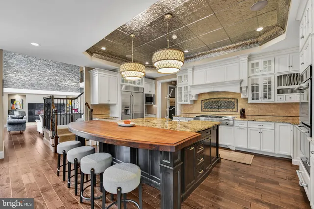 a living room with furniture and pool view