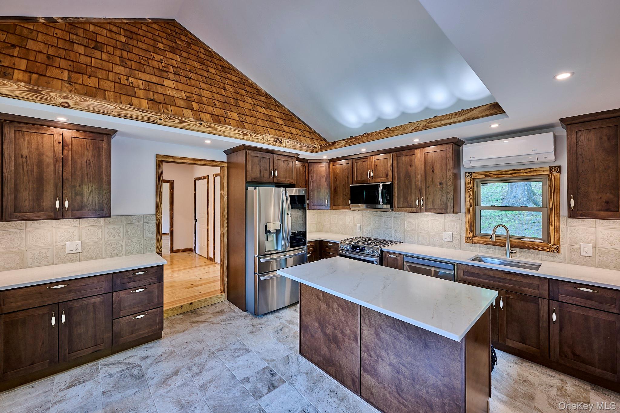 608 High Road Glen Spey, NY 12737 - Photo 13 of 37 a kitchen with stainless steel appliances granite countertop a sink stove and cabinets