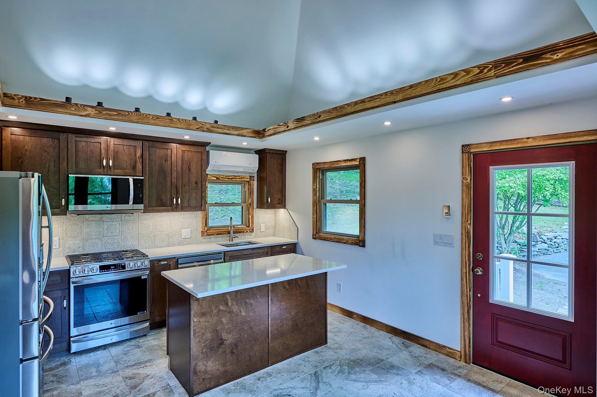 608 High Road Glen Spey, NY 12737 - Photo 14 of 37 a kitchen with sink a microwave and cabinets