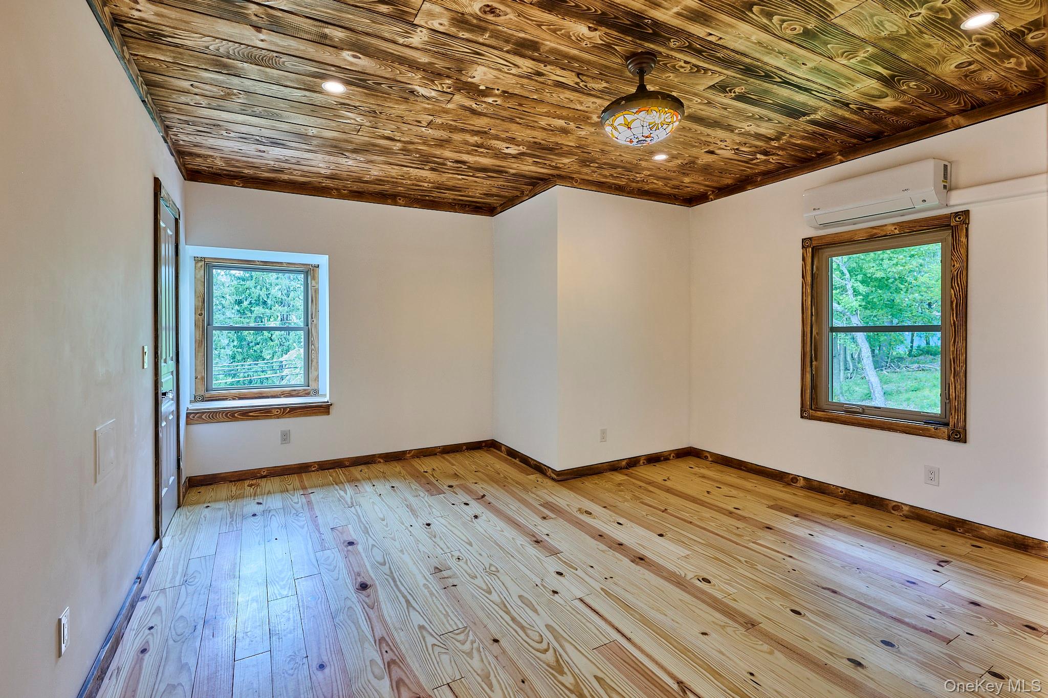 608 High Road Glen Spey, NY 12737 - Photo 16 of 37 a view of an empty room with wooden floor and a window
