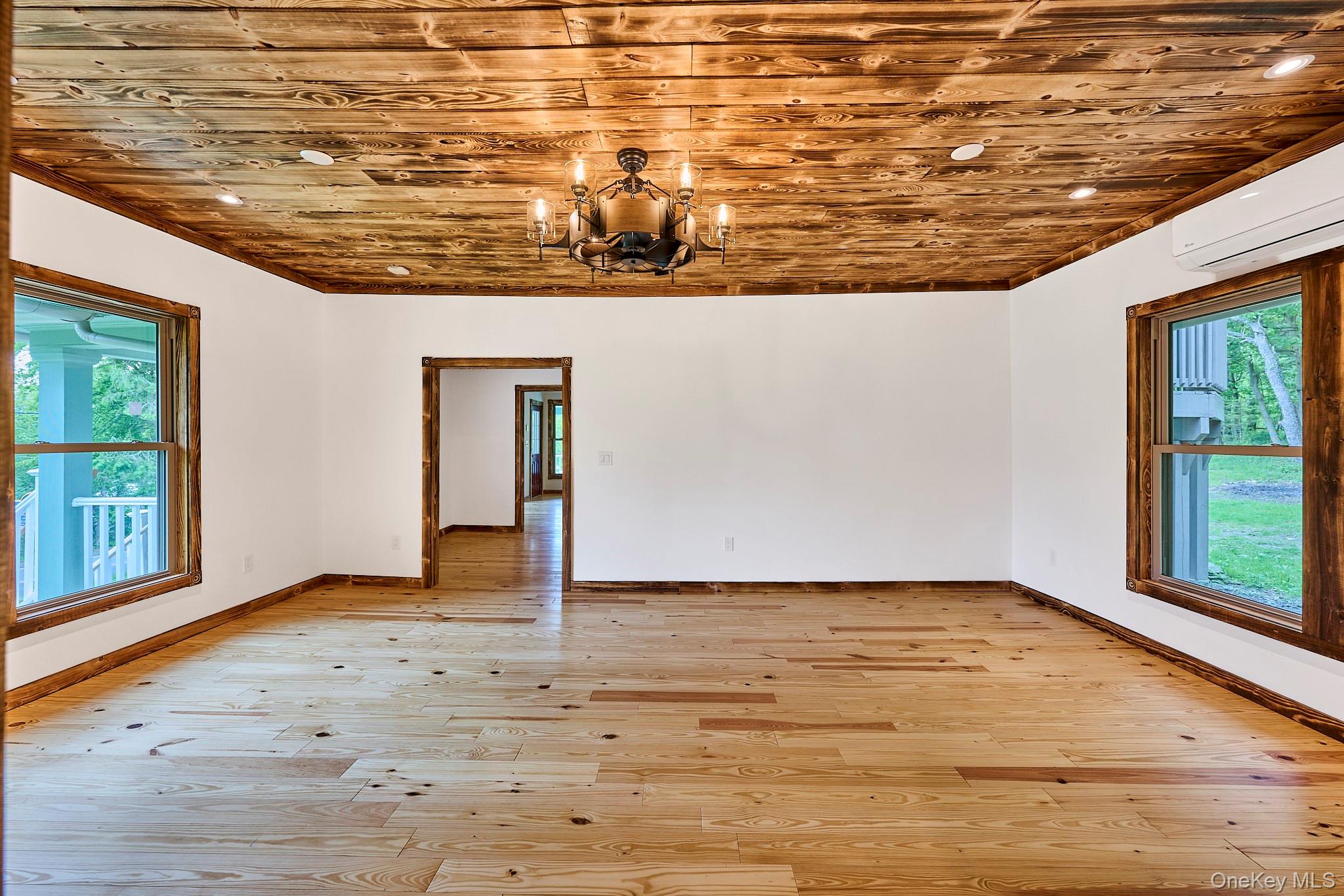608 High Road Glen Spey, NY 12737 - Photo 17 of 37 a view of an empty room with wooden floor and a window
