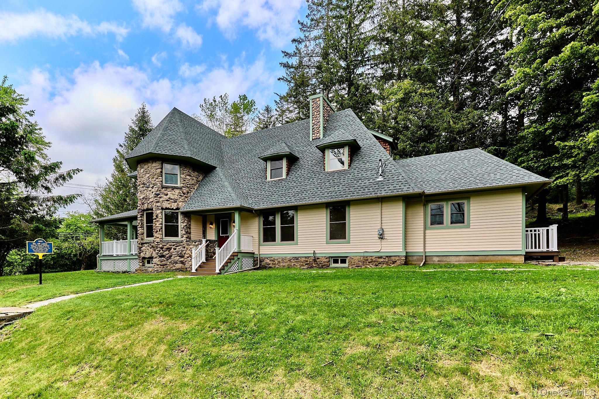 608 High Road Glen Spey, NY 12737 - Photo 2 of 37 a front view of a house with garden