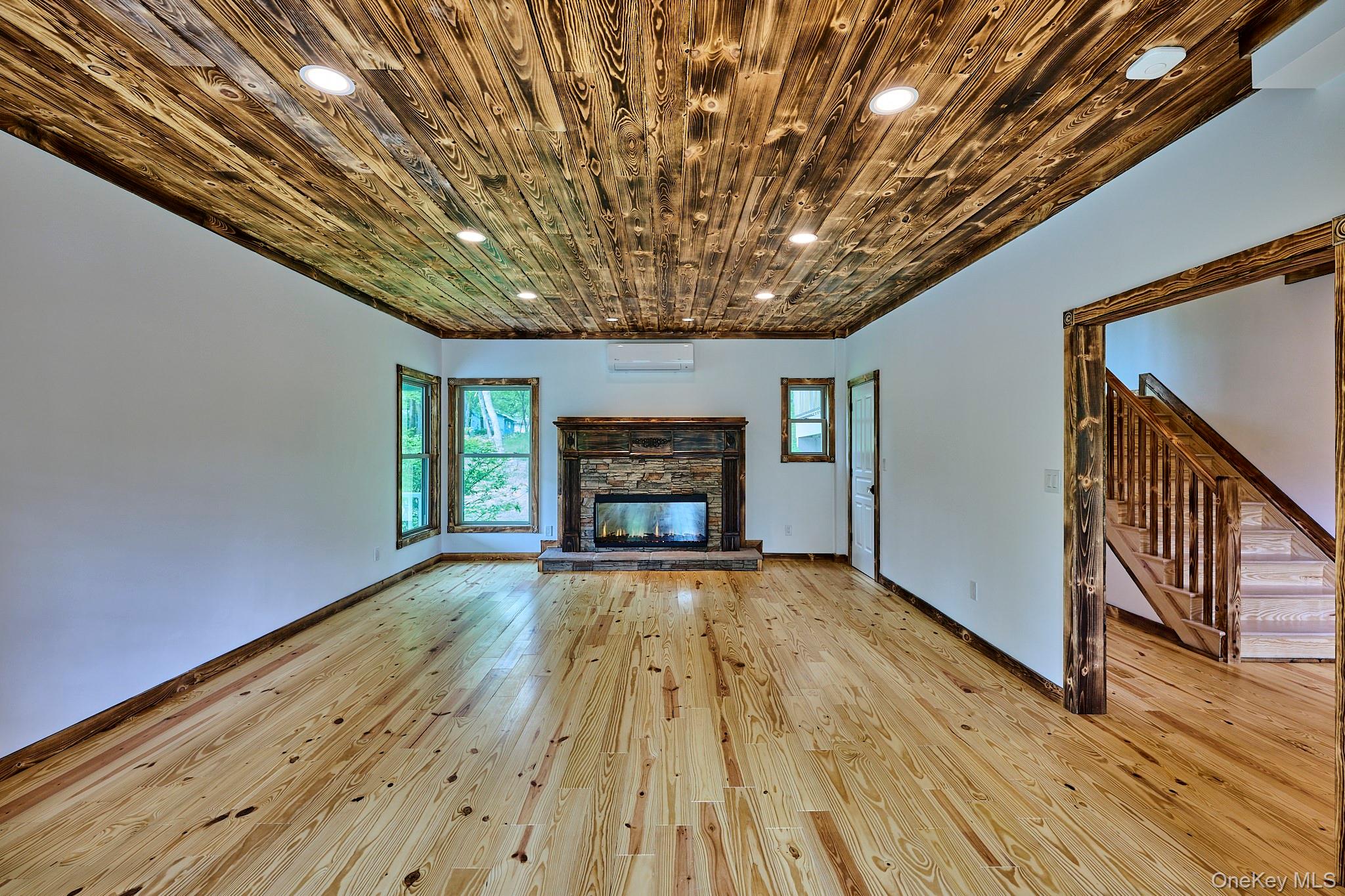 608 High Road Glen Spey, NY 12737 - Photo 22 of 37 a view of an empty room with wooden floor and a window