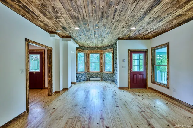 a bathroom with a granite countertop sink a toilet and shower