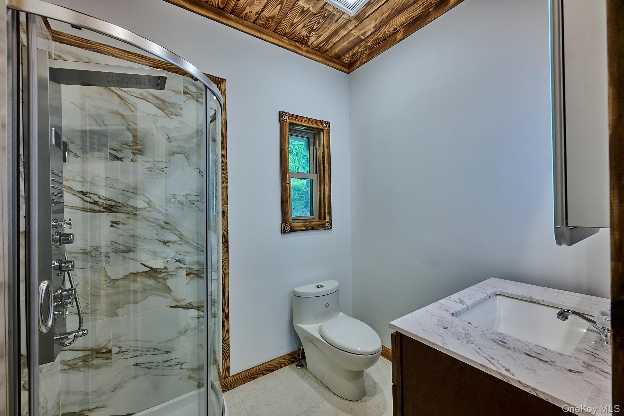 608 High Road Glen Spey, NY 12737 - Photo 24 of 37 a bathroom with a granite countertop sink a toilet and shower