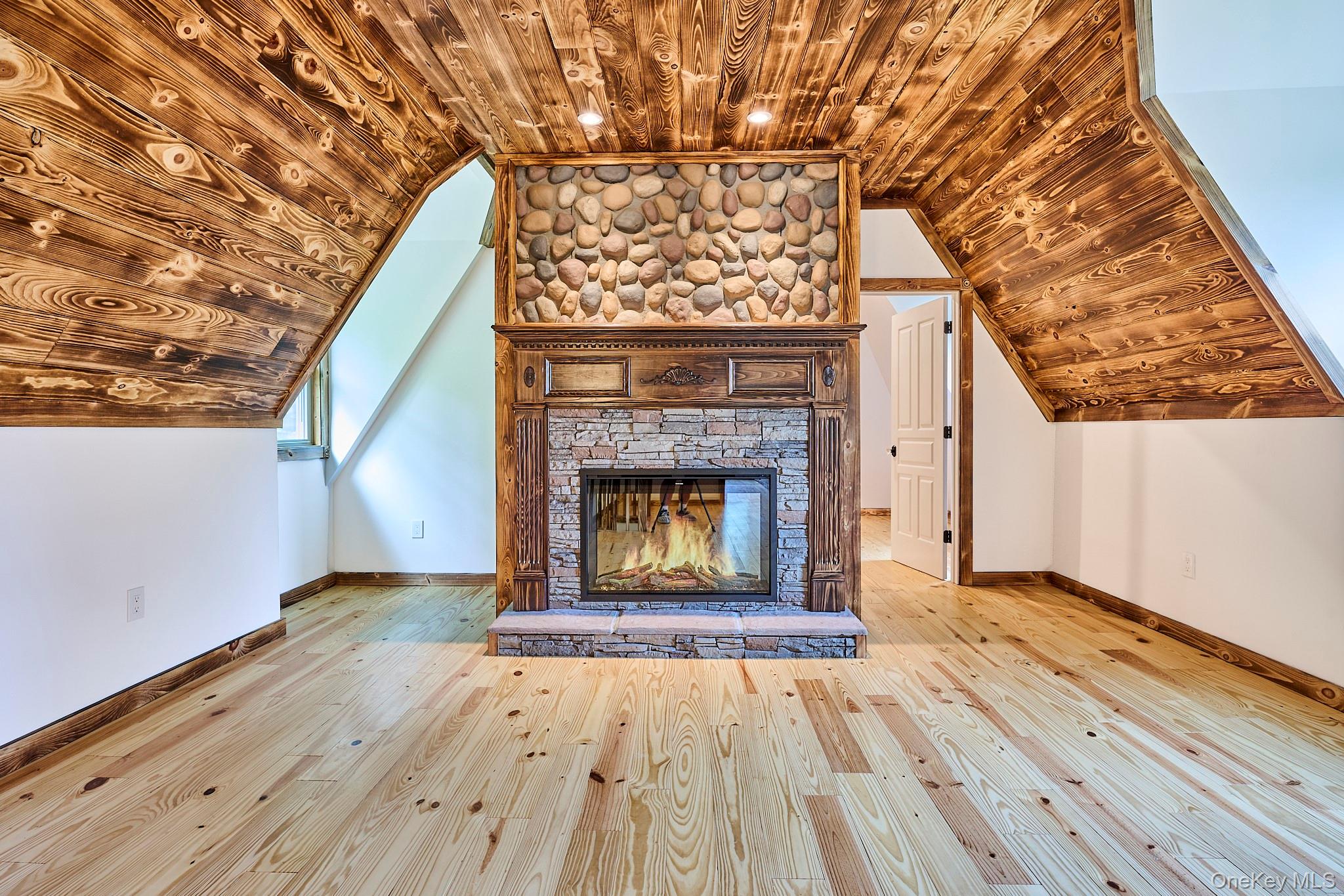 608 High Road Glen Spey, NY 12737 - Photo 29 of 37 a view of an empty room with wooden floor fireplace and a window