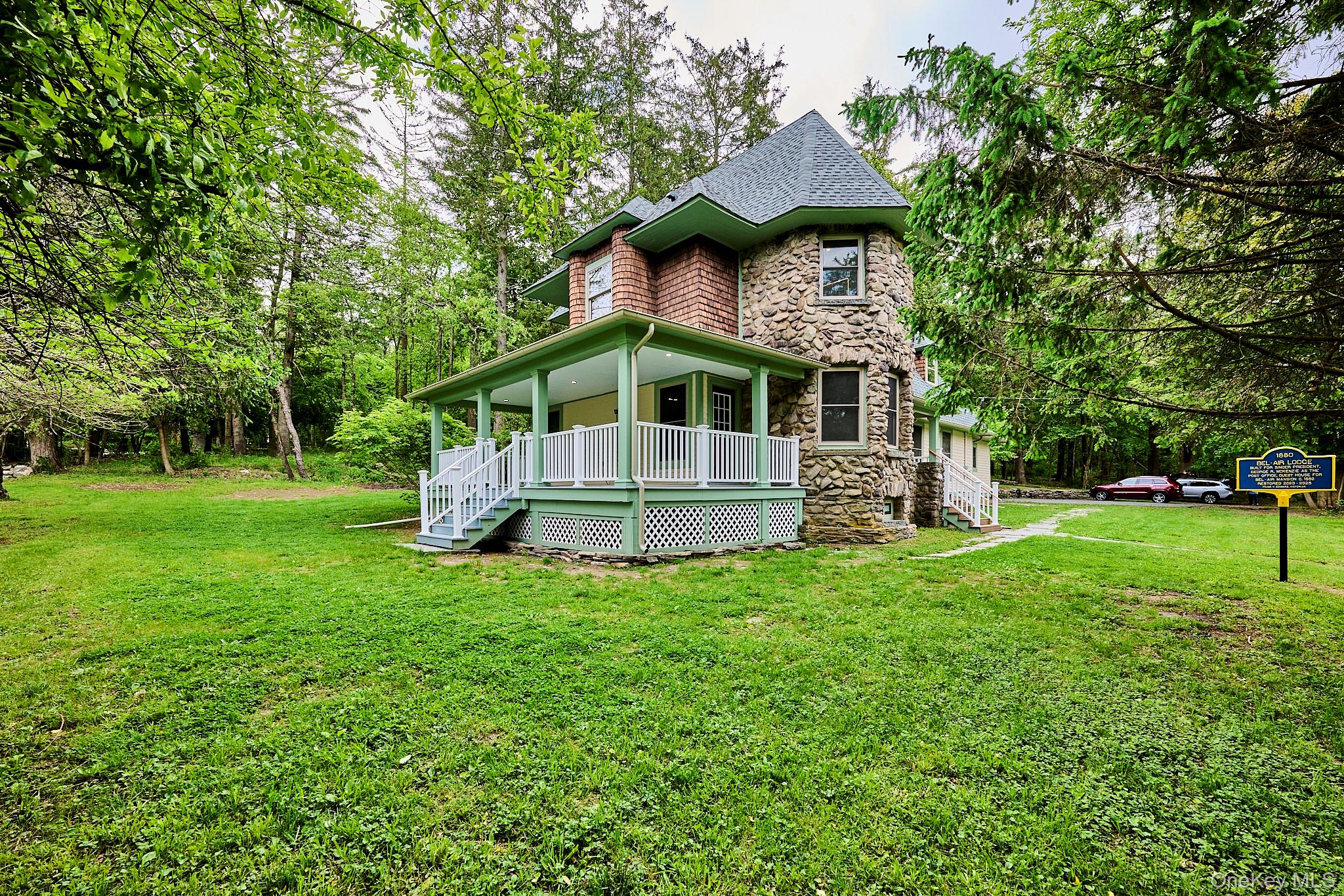 608 High Road Glen Spey, NY 12737 - Photo 4 of 37 a front view of a house with a yard and trees