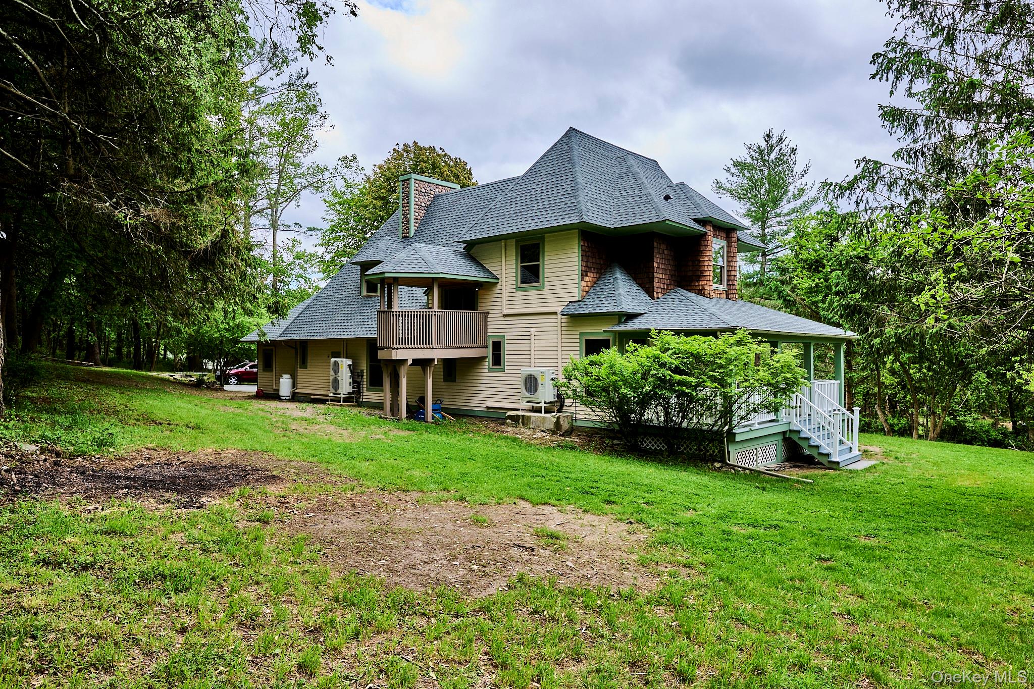 608 High Road Glen Spey, NY 12737 - Photo 7 of 37 a front view of a house with garden