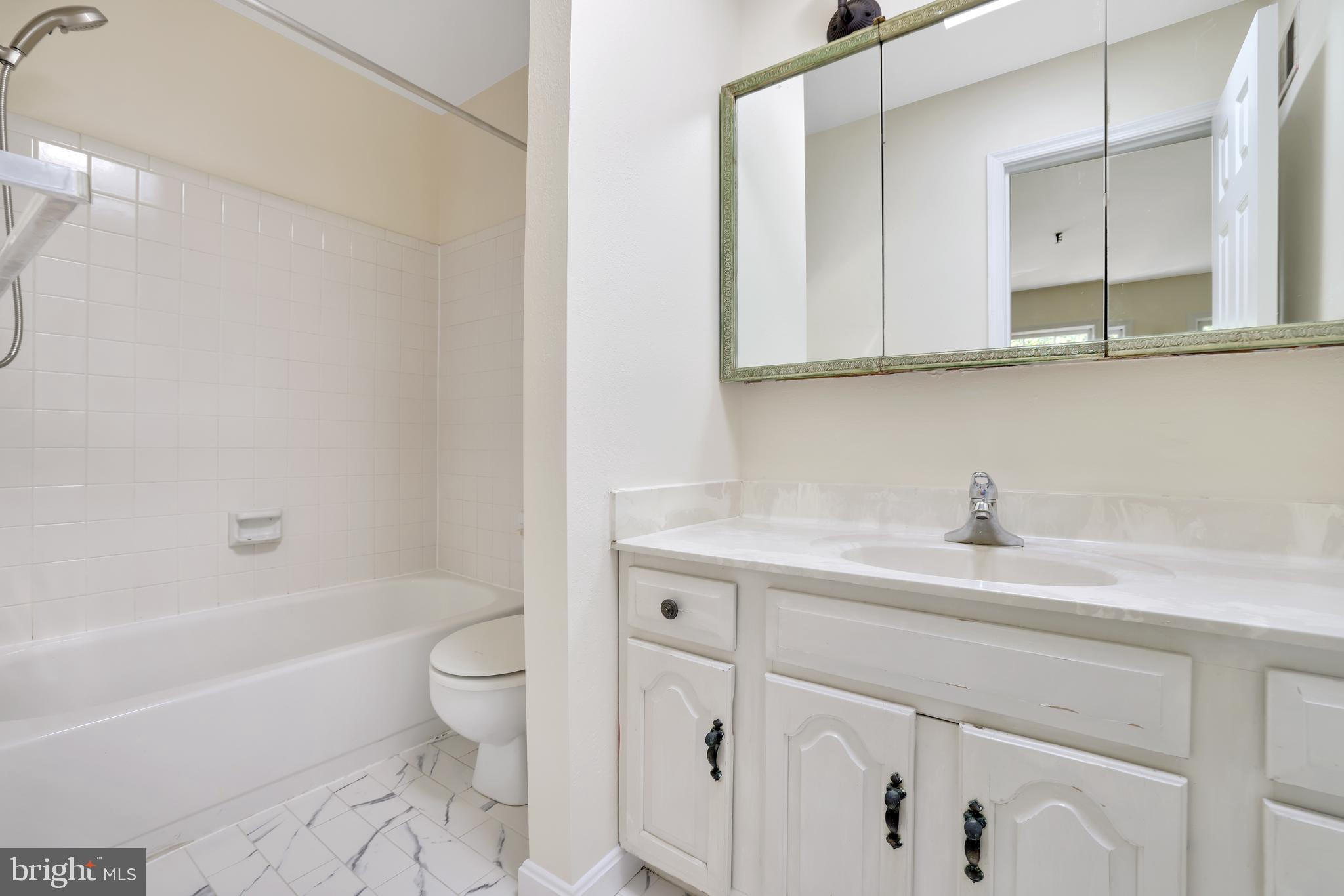 1649 Park Road Northwest Washington, DC 20010 - Photo 16 of 33 a bathroom with a sink a toilet and a bathtub
