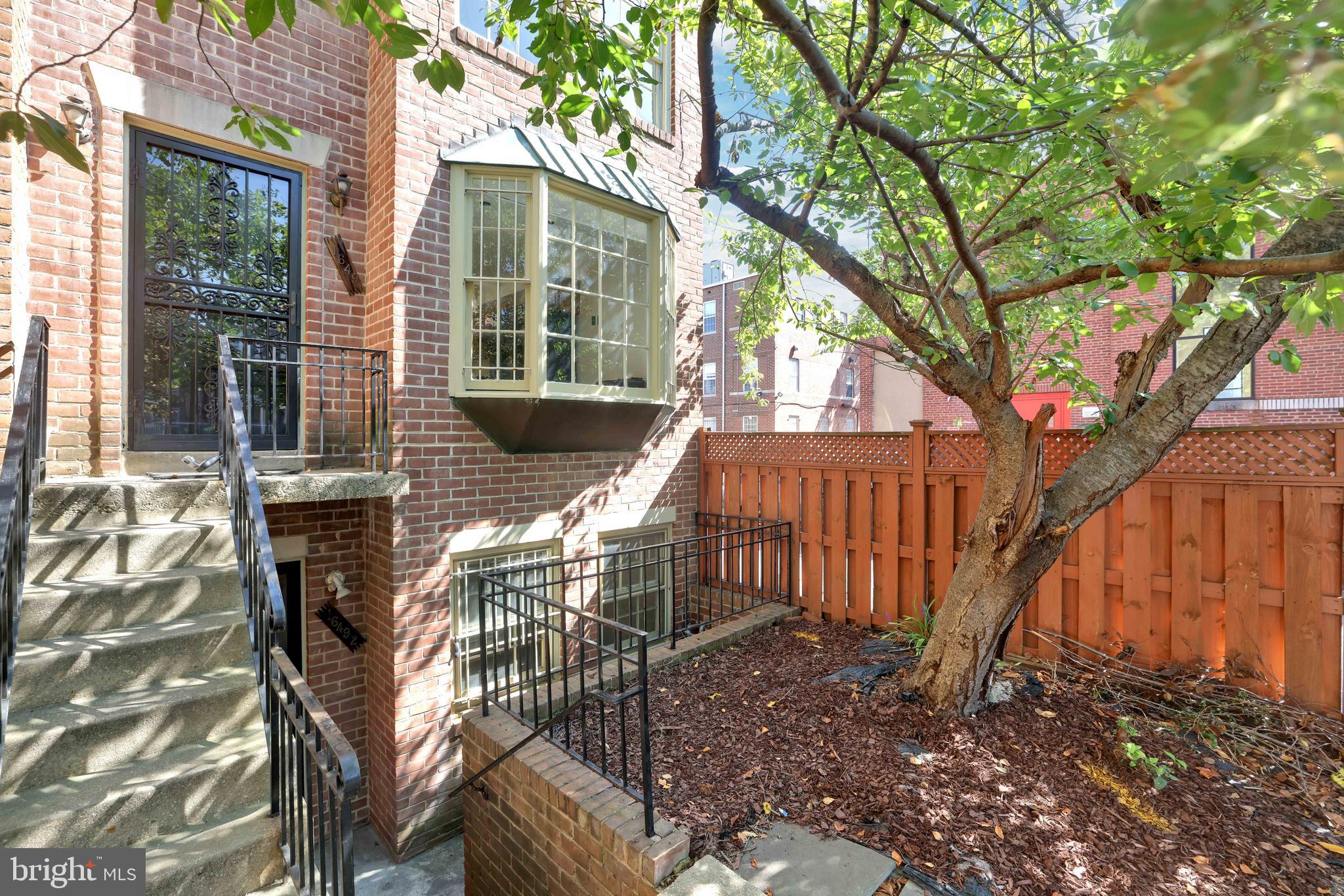 1649 Park Road Northwest Washington, DC 20010 - Photo 30 of 33 a view of a house with backyard and sitting area