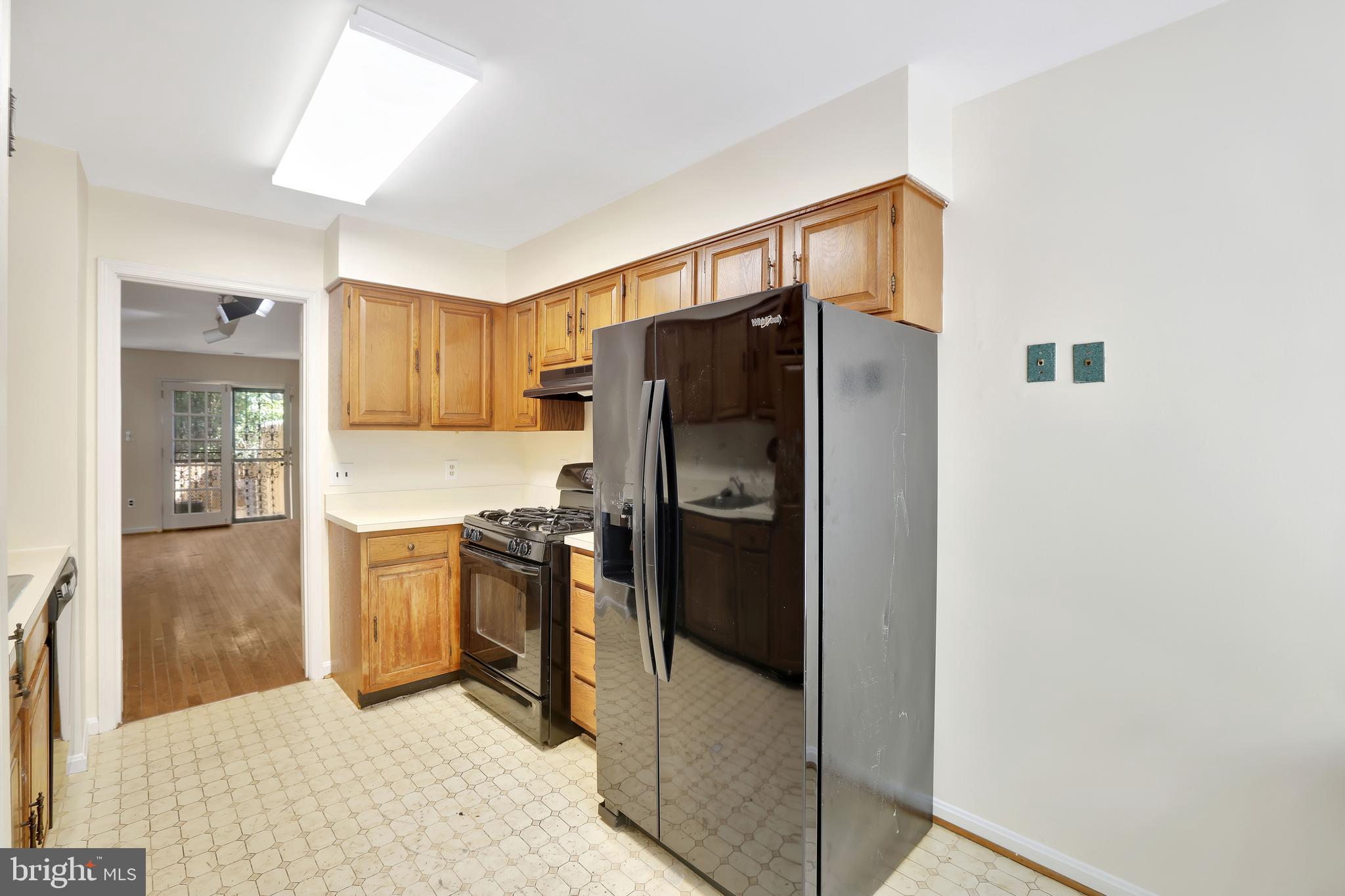 1649 Park Road Northwest Washington, DC 20010 - Photo 7 of 33 a kitchen with stainless steel appliances a refrigerator and a stove