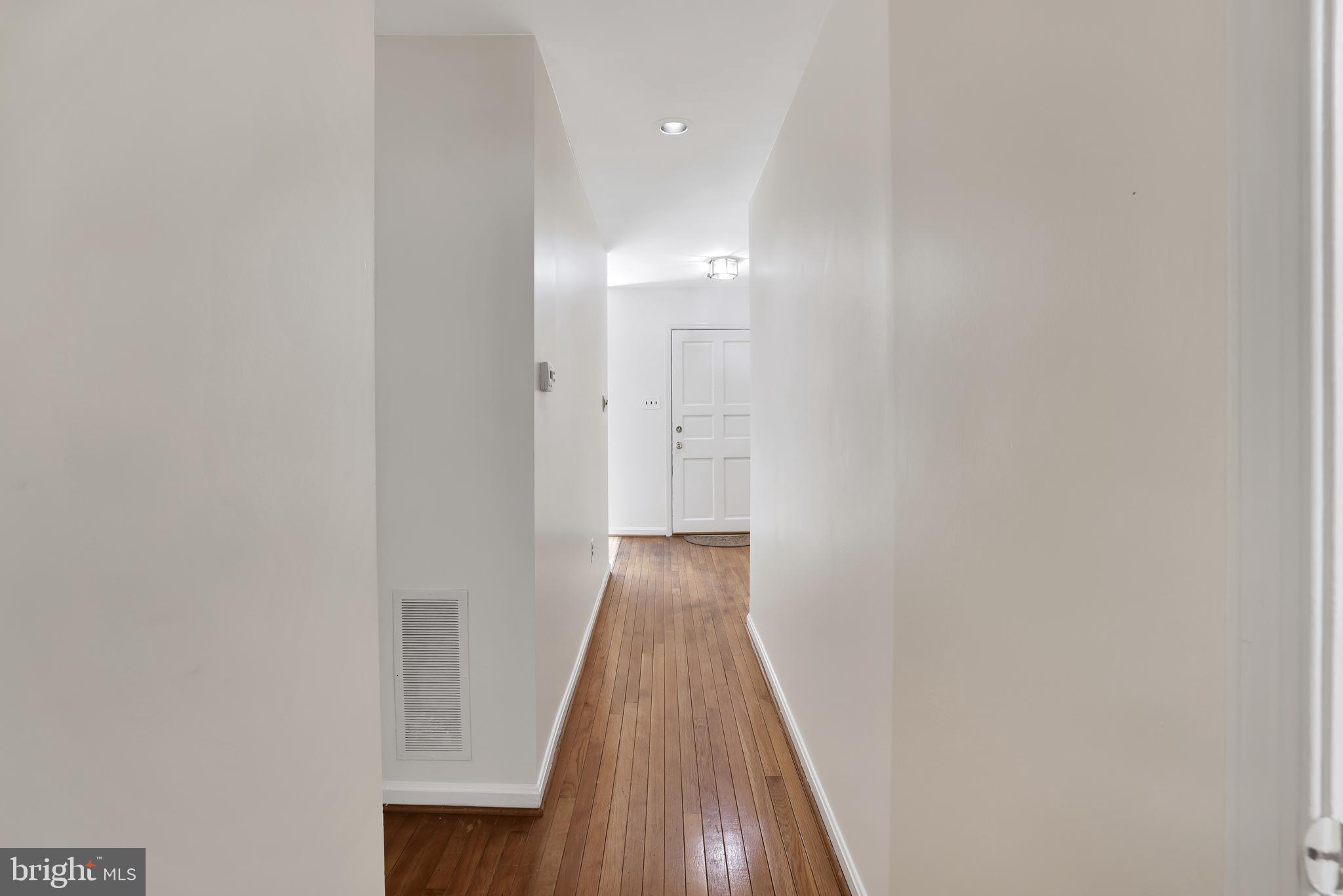 1649 Park Road Northwest Washington, DC 20010 - Photo 9 of 33 a view of a hallway with wooden floor