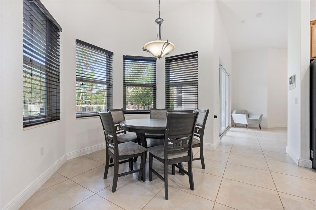 15651 Southwest 15th Street Davie, FL 33326 - Photo 20 of 47 a view of a dining room with furniture and windows