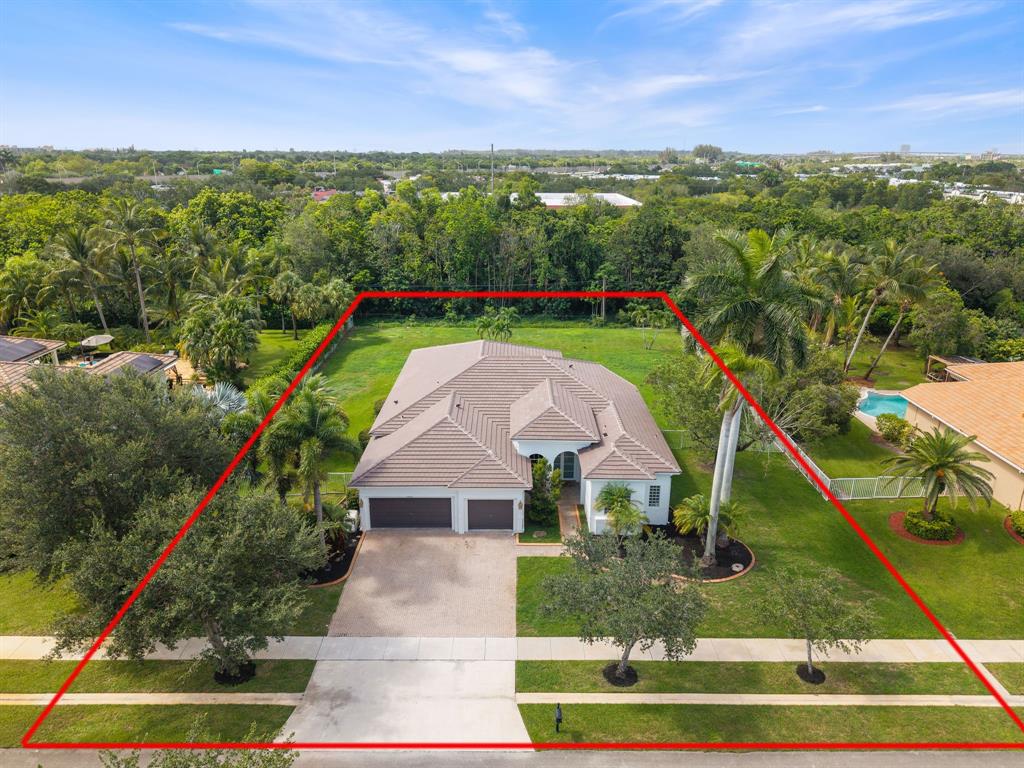 15651 Southwest 15th Street Davie, FL 33326 - Photo 2 of 47 a aerial view of a house with a yard