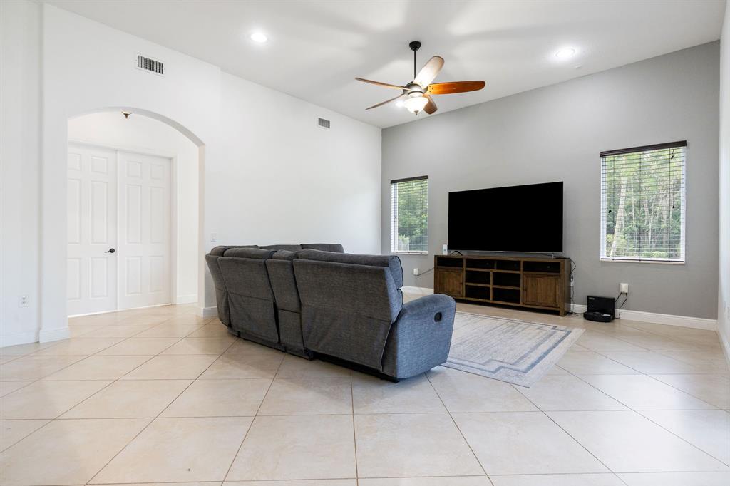 15651 Southwest 15th Street Davie, FL 33326 - Photo 22 of 47 a living room with furniture and a flat screen tv