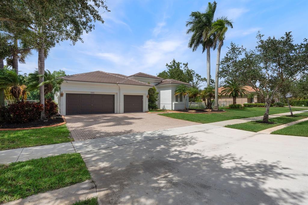 15651 Southwest 15th Street Davie, FL 33326 - Photo 3 of 47 a front view of house with yard and green space