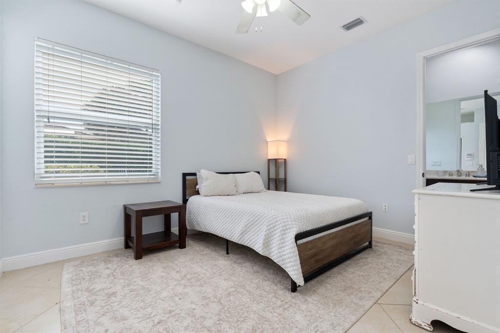 15651 Southwest 15th Street Davie, FL 33326 - Photo 39 of 47 a spacious bedroom with a bed and a window
