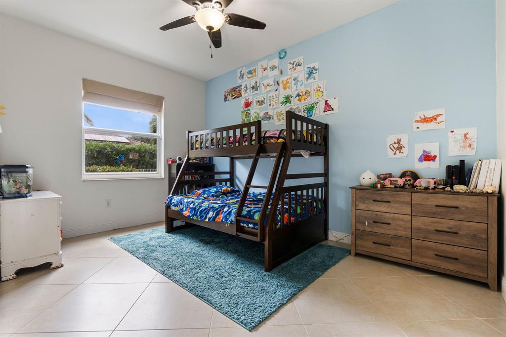 15651 Southwest 15th Street Davie, FL 33326 - Photo 41 of 47 a bedroom with furniture and a baby crib
