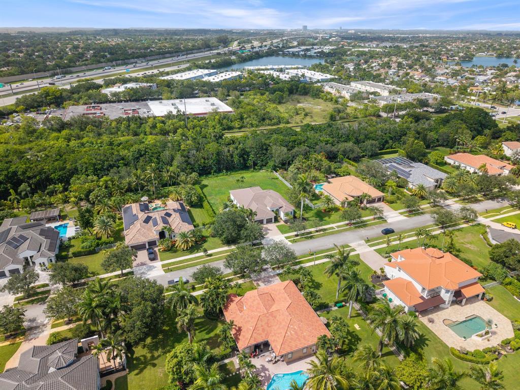15651 Southwest 15th Street Davie, FL 33326 - Photo 45 of 47 an aerial view of residential houses with outdoor space and river