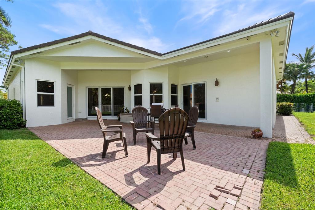 15651 Southwest 15th Street Davie, FL 33326 - Photo 9 of 47 a view of a house with backyard and porch