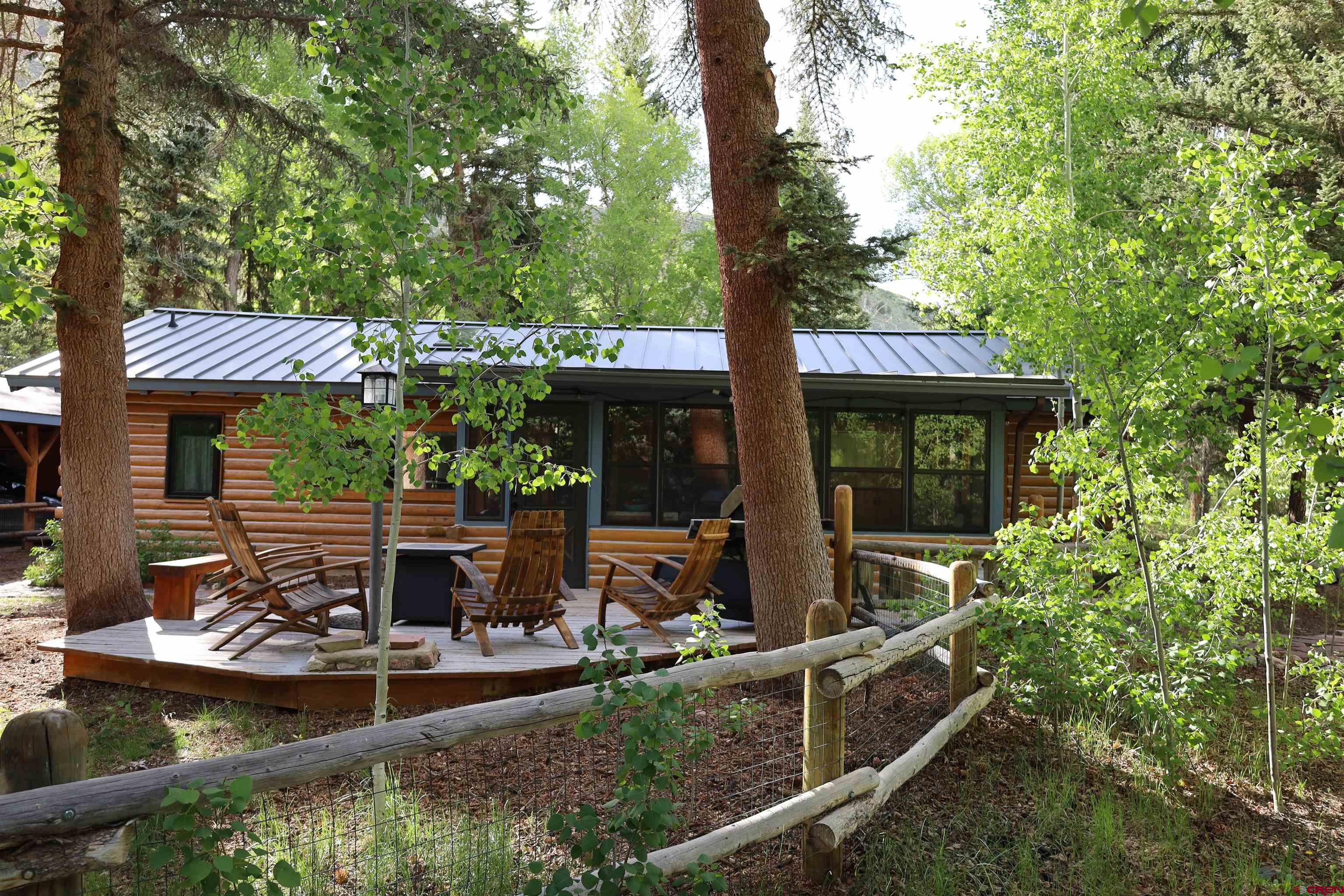 95 Deerpath Lane, Unit RIVERFRONT Almont, CO 81210 - Photo 1 of 35 a front view of a house with garden