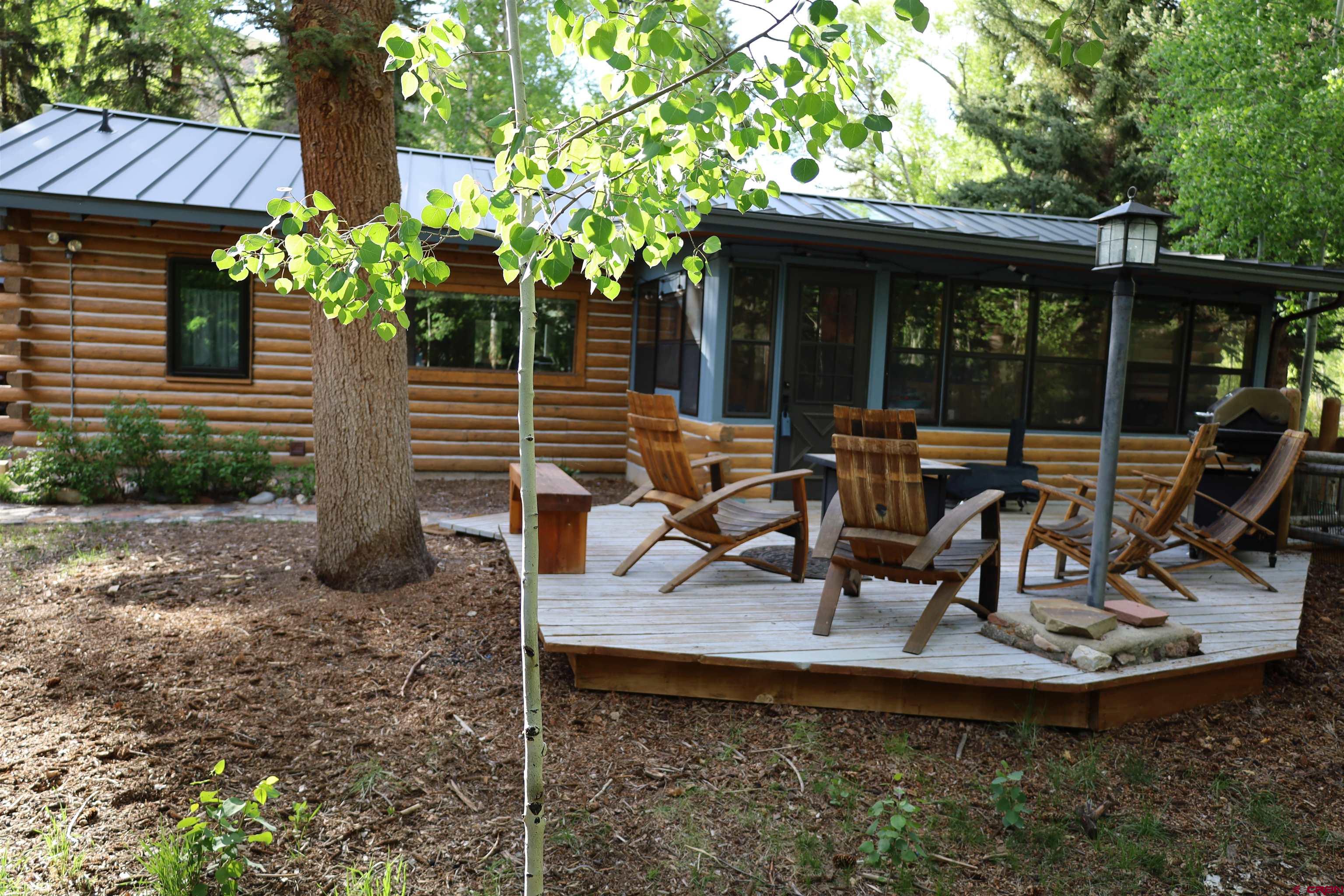95 Deerpath Lane, Unit RIVERFRONT Almont, CO 81210 - Photo 11 of 35 a view of a house with backyard outdoor seating area and furniture