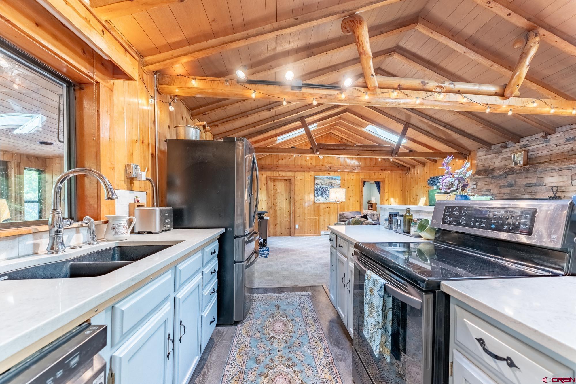 95 Deerpath Lane, Unit RIVERFRONT Almont, CO 81210 - Photo 18 of 35 a kitchen with a stove and a sink