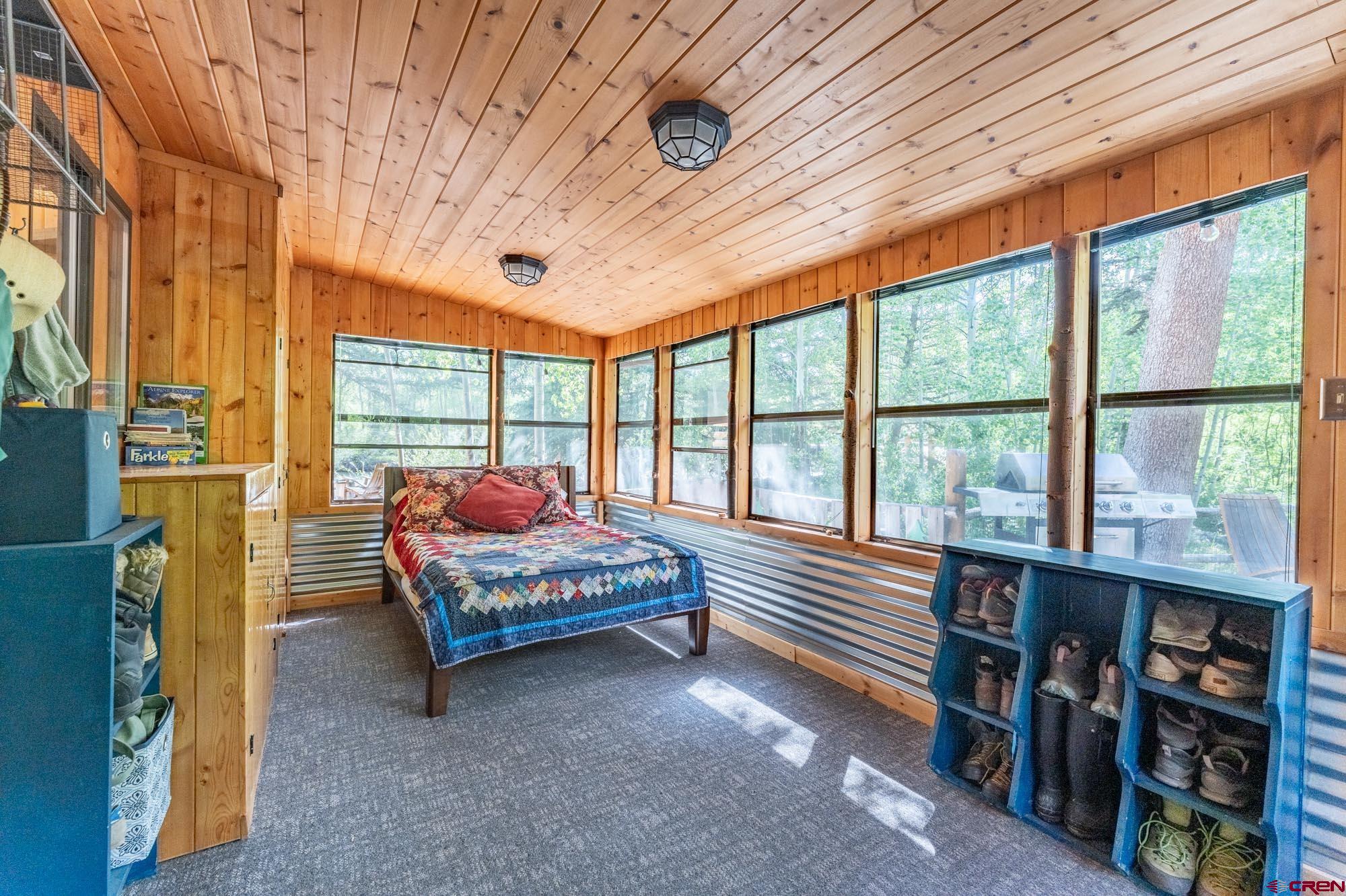 95 Deerpath Lane, Unit RIVERFRONT Almont, CO 81210 - Photo 31 of 35 a bedroom with furniture and a large window