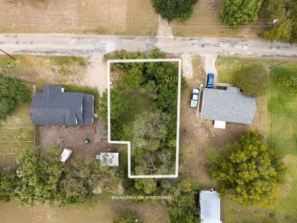 aerial view of a house with a yard