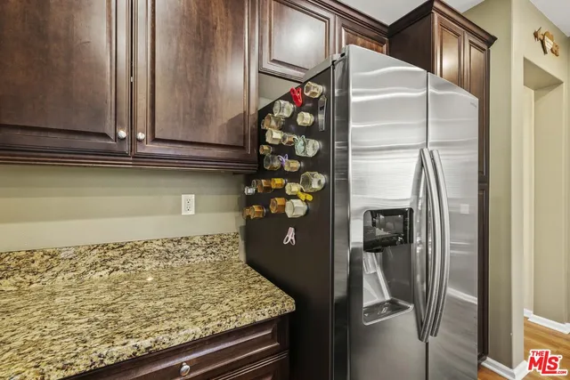 a kitchen with a refrigerator and a microwave