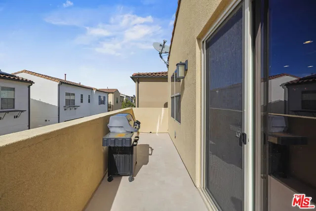 a view of a balcony with chairs