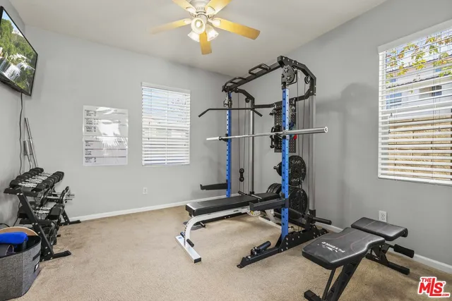 a room with gym equipment and a window