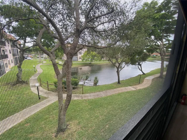 a view of a porch and garden