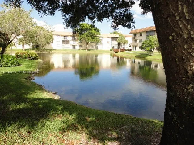 a view of a swimming pool with a garden