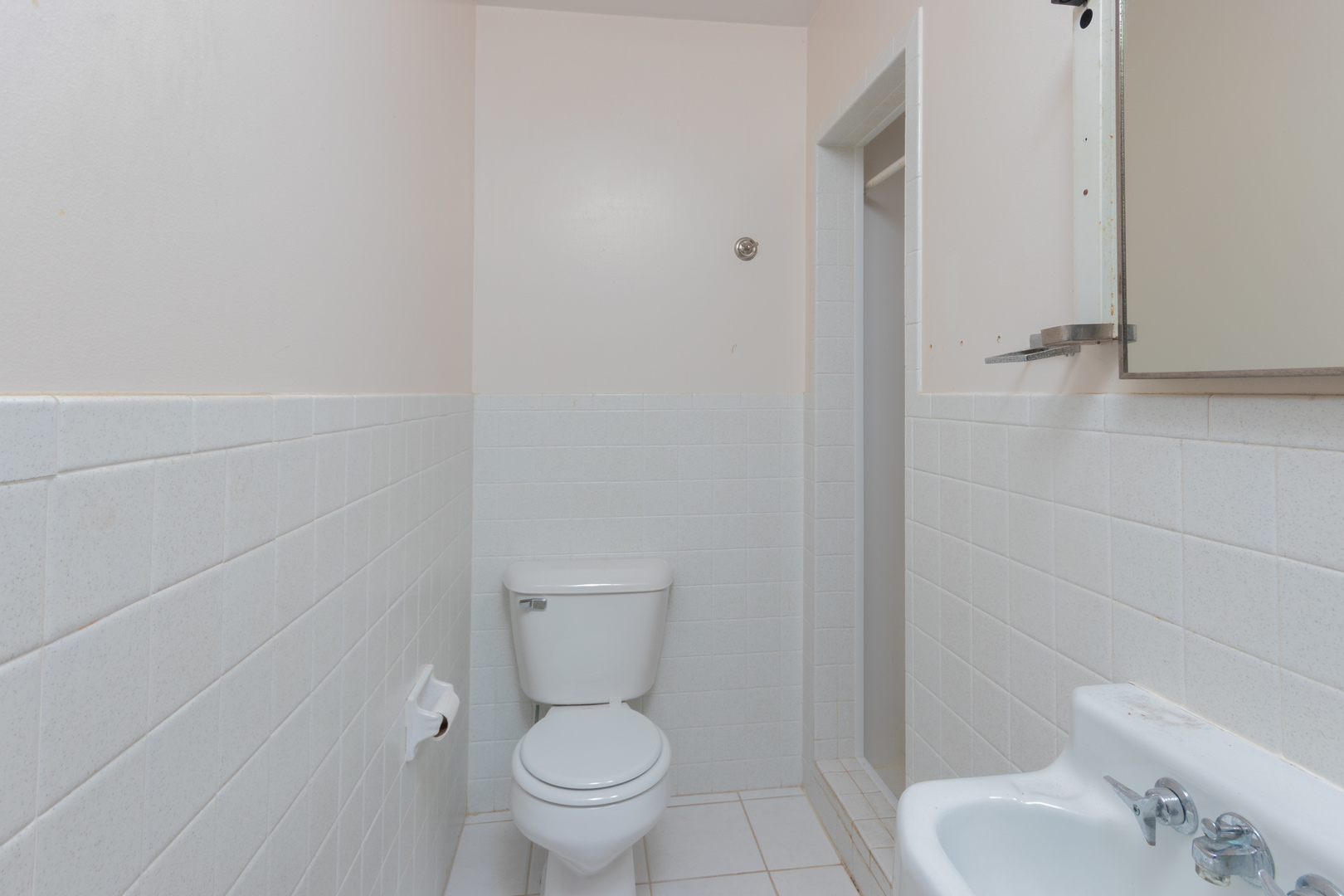 9096 Wesson Road Leland, IL 60531 - Photo 21 of 29 a white toilet sitting next to a bathroom sink